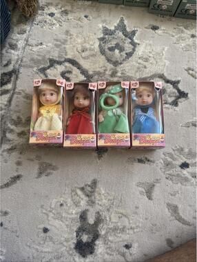 Set of 4 Baby Doll Figurines in Colorful Outfits